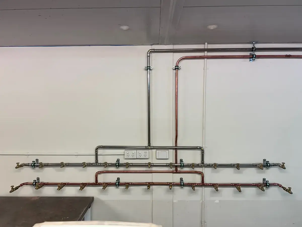 Premium plumbing tools arranged on a marble workbench